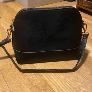 Black cross body purse with cheetah print interior